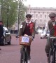 Scores of people ride through London dressed in tweed