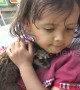 Too cute! Girl rides motorscooter with pet baby civet