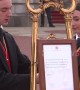 Moment Buckingham Palace staff place notice on easel announcing Harry and Meghan’s baby