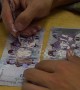 Venezuelan migrants create beautiful watercolour portraits out of worthless notes in Bogota, Colombia