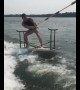 Guy water skies on top of folding table