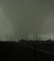 Absolute monster tornado rocks Booker Texas USA as it sweeps across the highway