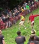 Daredevils run down Cooper's Hill for Gloucestershire Cheese Rolling race, UK