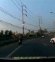 Thai motorcyclist miraculously avoids injury after car flips on top of him