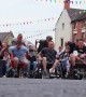 Boozy competitors race around UK town in wheelbarrows drinking beer along the way