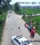 Motorcycle flips through the air after head-on car crash, throwing rider onto bonnet