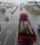 Chinese moped rider slides out of path of oncoming lorry in amazing near-miss