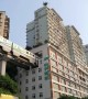 Elevated trainline runs through hole in building in China's Chongqing