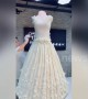 Chinese baker sculptures giant cake into amazing wedding dress
