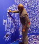 Nigerian artist Victor Ekpuk adds finishing touches to show in London