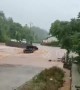Flash floods sweep away car after driver tried to force their way through submerged road in China