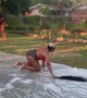 Us woman crawls on slip and slide to retrieve wig after it drops off