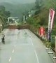 Massive landslide in China blocks highway seconds after motorcyclist drives past