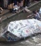 Boozed-up Cambridge University students celebrate end of exams with annual cardboard boat race