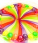 Skittles melt turning clear water into colours of the rainbow