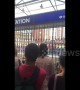 Commuters wait outside evacuated Victoria station after fire alert