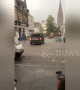 Bartenders chase after furniture being swept away by flooding in Scotland