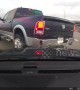 US truck driver 'fails to check blind spot' and slams into highway wall