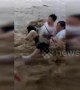 Pedestrians swept down road by flash flooding in China's Chongqing