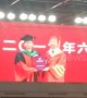Nervous graduate forgets to take diploma after having picture with university president in China
