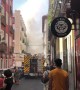 Firefighters on the scene as they attempt to extinguish flat fire in Madrid