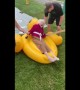 Elderly woman enjoys tube slide for Senior Heath and Wellness Day
