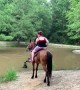Horse Sends Riders into Stream
