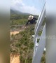Vietnamese electrical workers do line repairs at terrifying heights
