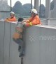 Firefighters rescue man clinging onto broken safety rope from 16th floor of building in China