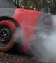US car bursts into smoke after red paint is poured into fuel tank