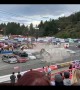 Car stunt man crashes into a high stack of cars
