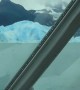 Incredible footage captures massive iceberg flipping over