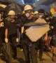 Hong Kong protesters create noise before a police push forces crowds back