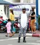 Kind-hearted policeman dresses as zebra to help children cross the road in Thailand