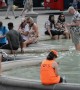 Locals and tourists cool off in London's fountains as blistering heatwave continues