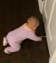 Baby is Mesmerized by Door Stop