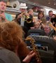 Passengers stranded on Heathrow flight dance to band during four hour wait