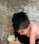 Kid Cowers from Water Balloon