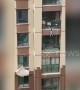 Kind-hearted people use duvets to catch boy falling from fifth-floor balcony in China