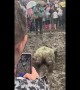 Girl swims in mud at Liverpool rock festival