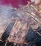 People enjoy roasted rats served in special barbecue shop in southern China