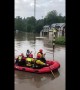 Emergency services use lifeboats to rescue stranded residents from flooding in Bramhall, Greater Manchester