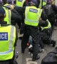 Tommy Robinson supporters clash with police in central London