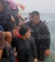Survivors cling to capsized boat after storm kills 11 in the Philippines