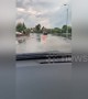 Cars plough through submerged Nottingham road after flooding