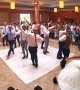 Bride surprised with dance led by groom and his groomsmen