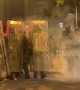 Masked youths in Hong Kong throw bricks and glass bottles at riot police