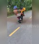 Man performs one-wheeled motorbike wheelie stunt in Bangkok