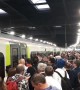 Long line of passengers wait to board train at Euston station in London