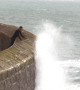 Huge waves crash over harbour wall in Cornwall drenching locals braving the rough seas
